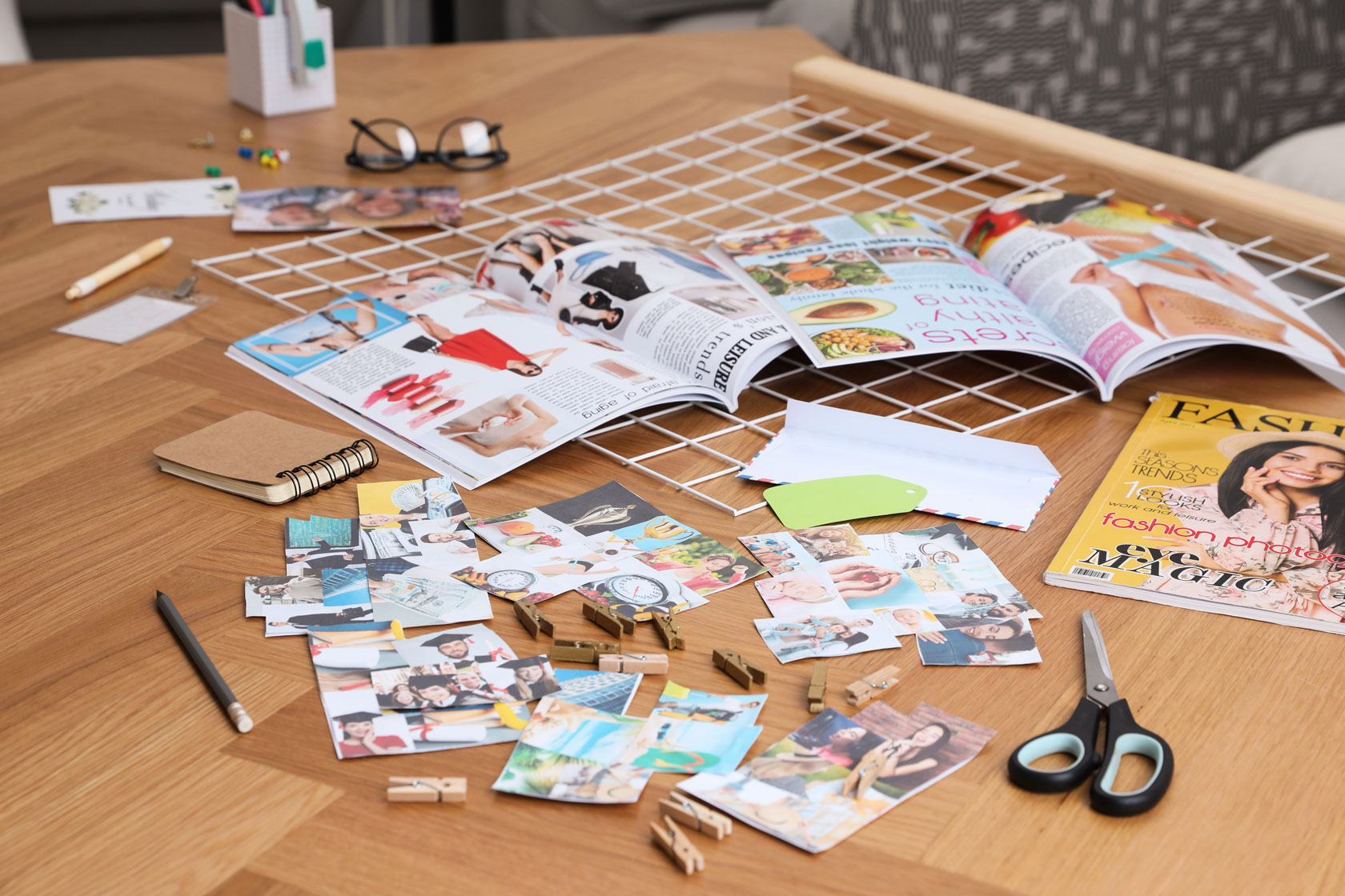 Magazine clippings laid out on a table.